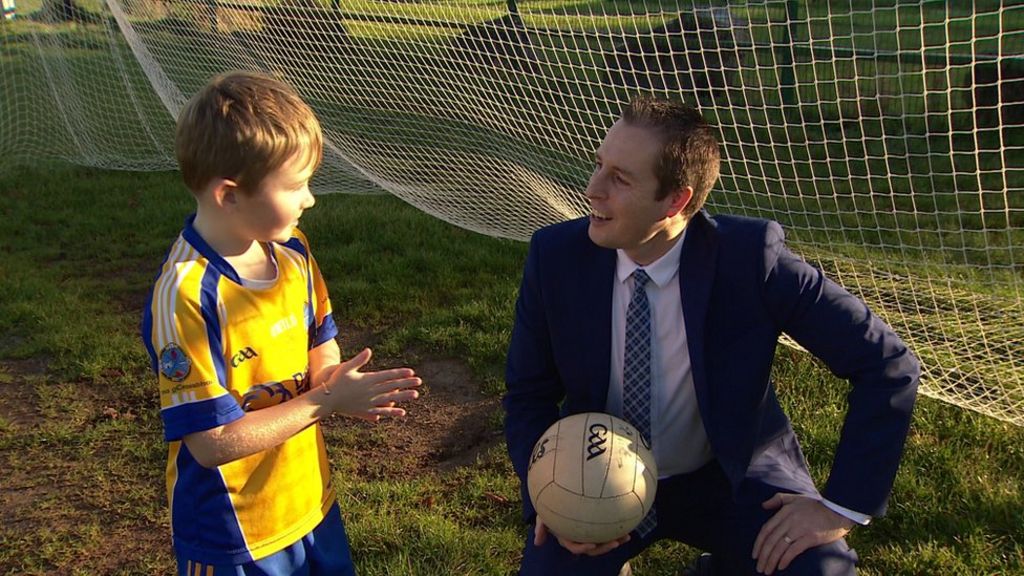Paul Givan: DUP sports minister's first appearance on GAA pitch