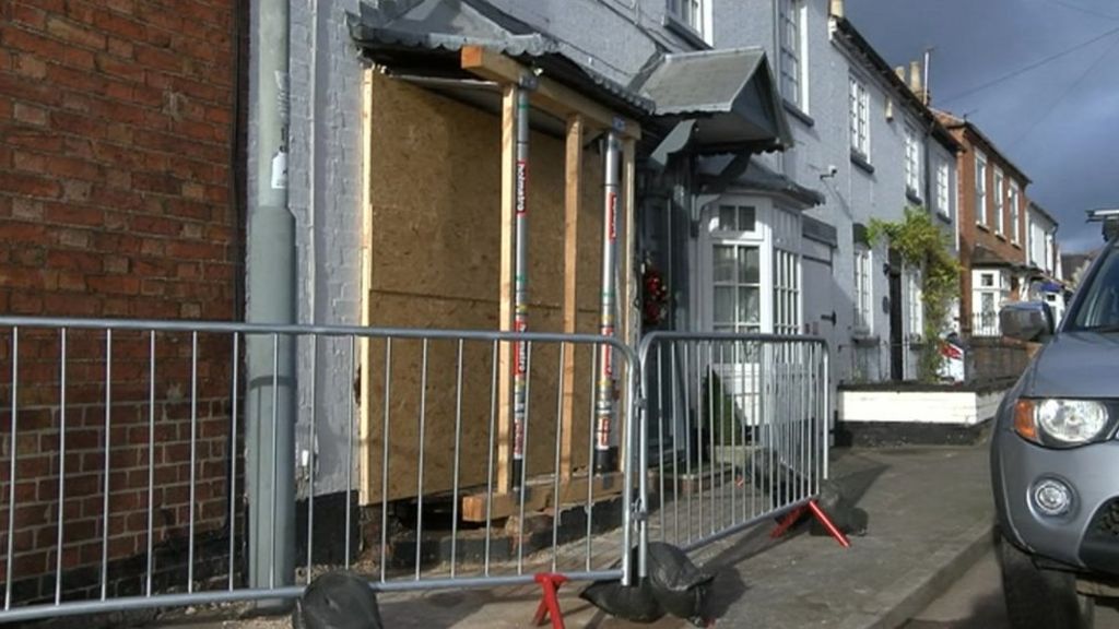 Man hurt as car crashes into house