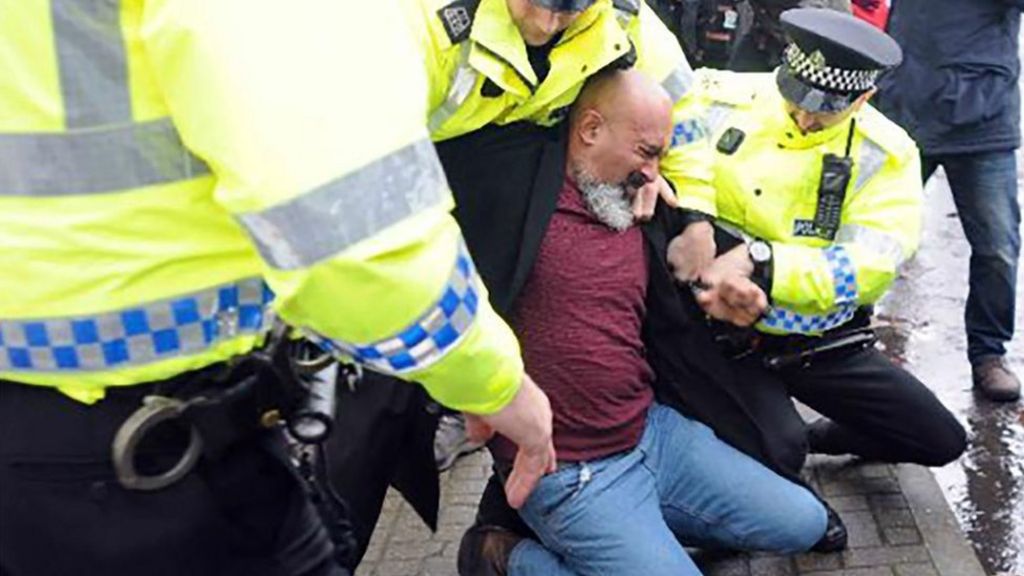 Race relations worker guilty of racist abuse at refugee rally