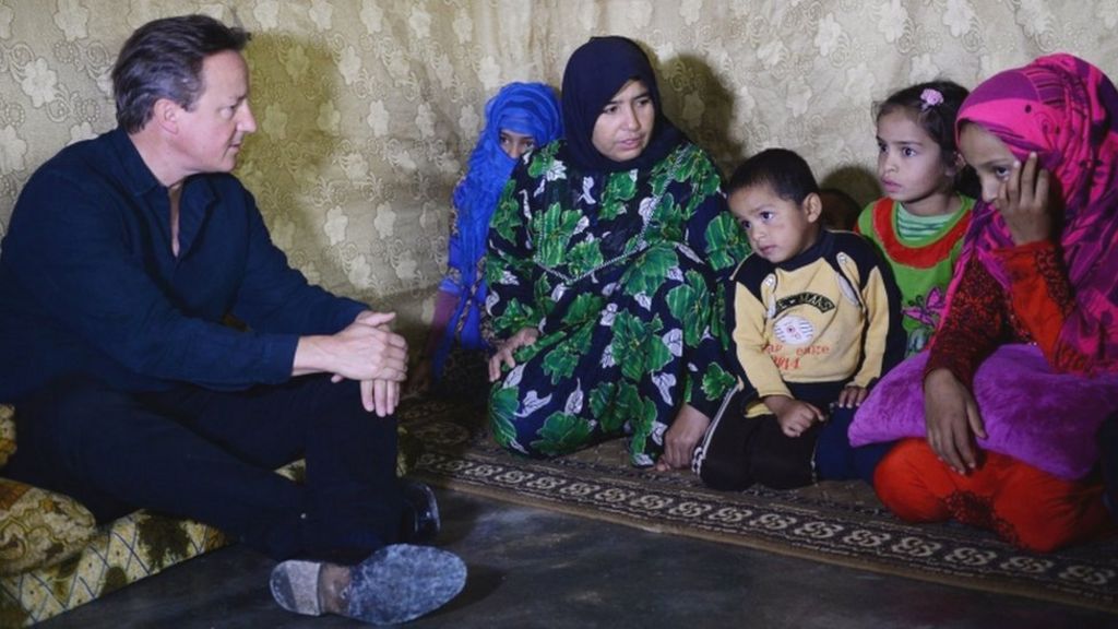 First of 20,000 Syrians arrive in UK