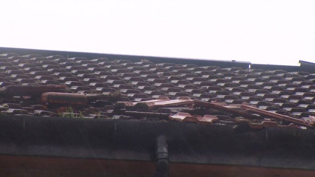 Rooftop incident closes city road