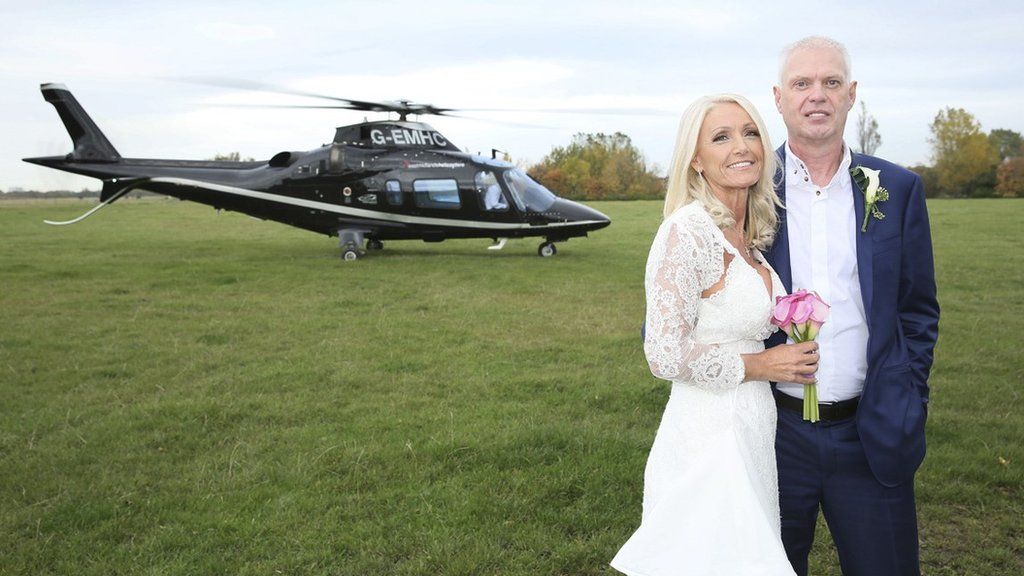 Bride and groom's helicopter happiness