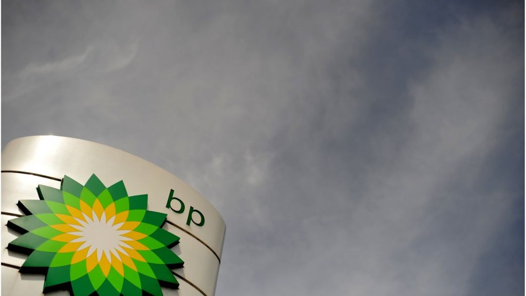 BP shares slide 9% as profits halve