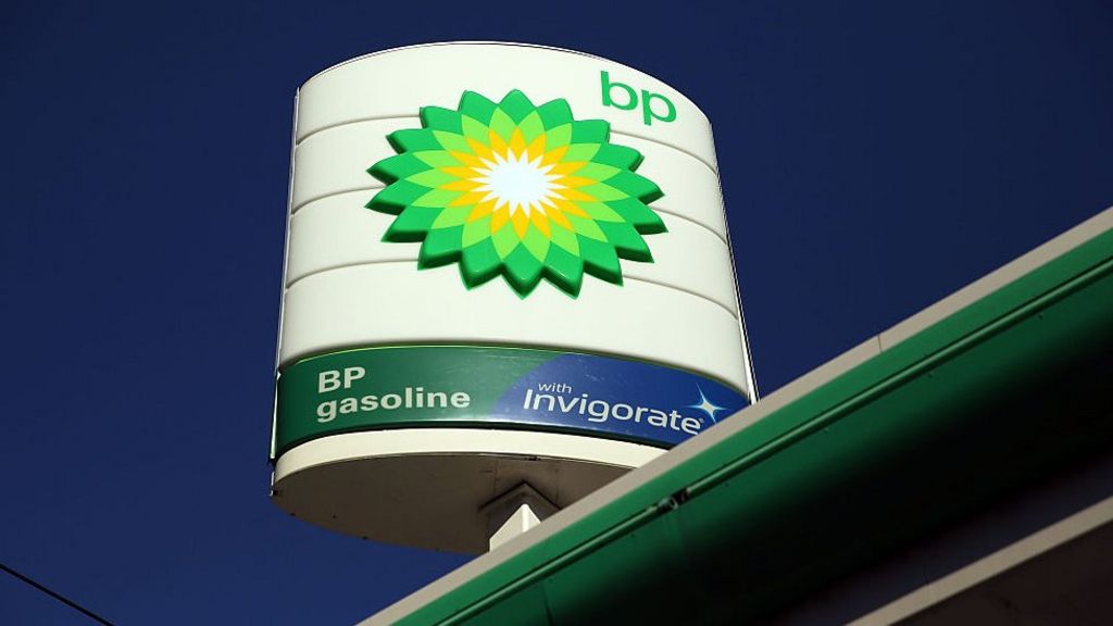 Oil giant BP sees profits nearly halve