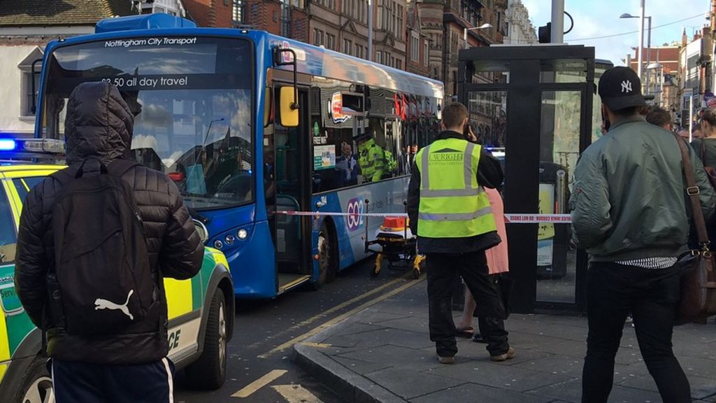 Two hit by bus outside shopping centre