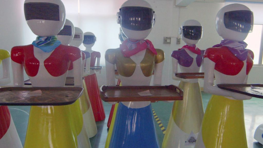 Inside a factory making robot waiters and waitresses