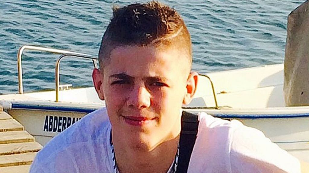 Third man charged after concrete block death