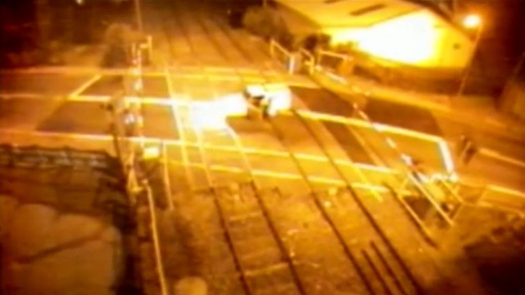 Reliant Robin driven on to rail line