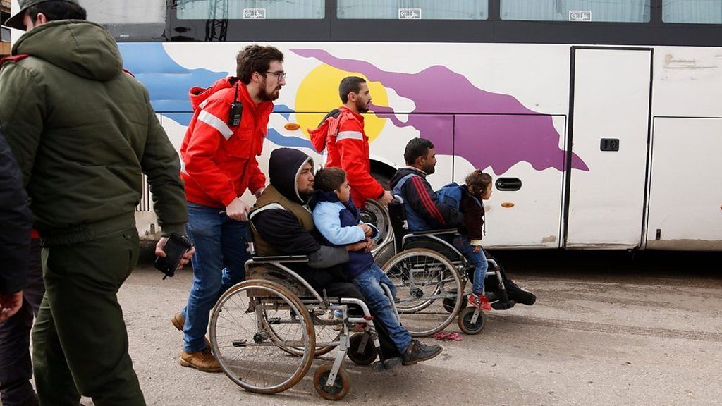 Syrian rebels and families leave Homs