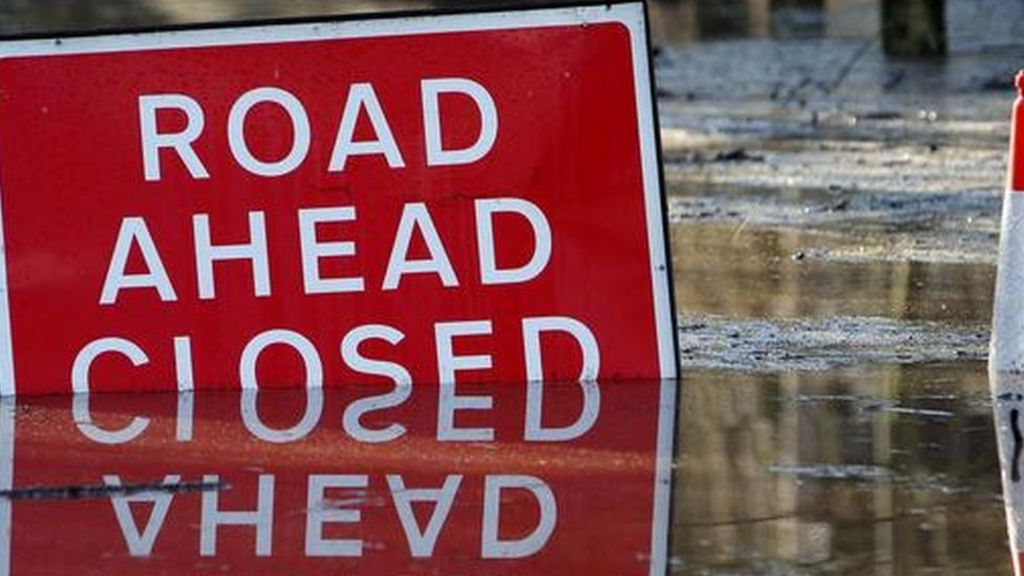 Motorists charged over flood signs