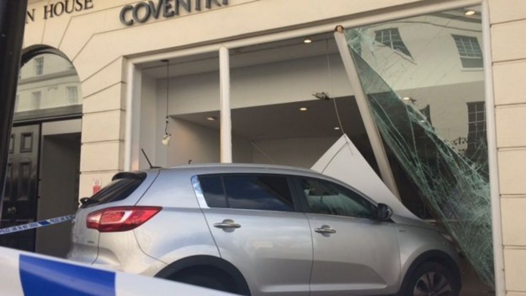 Car driven into building society