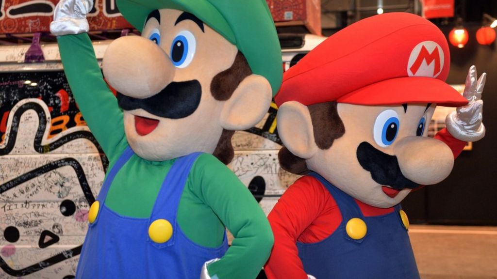 Nintendo halves profit forecast
