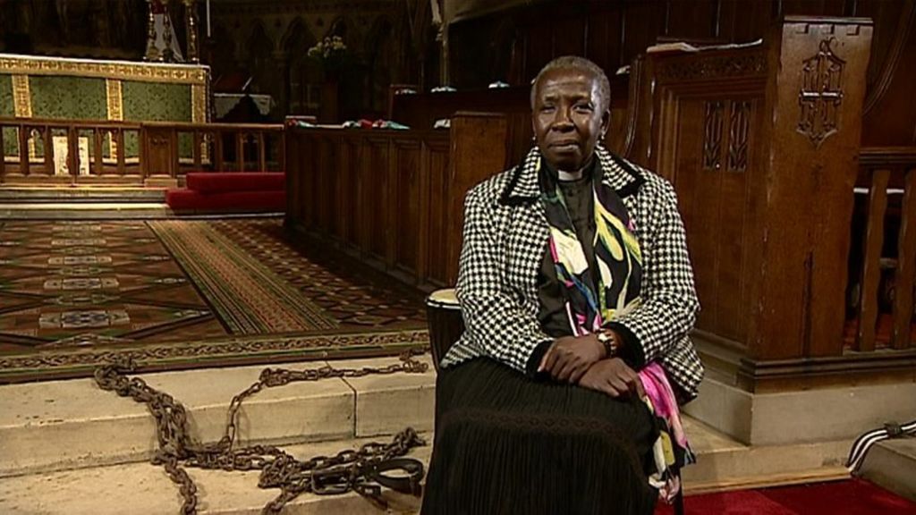 Black priest walks in 'slave' chains to promote remembrance
