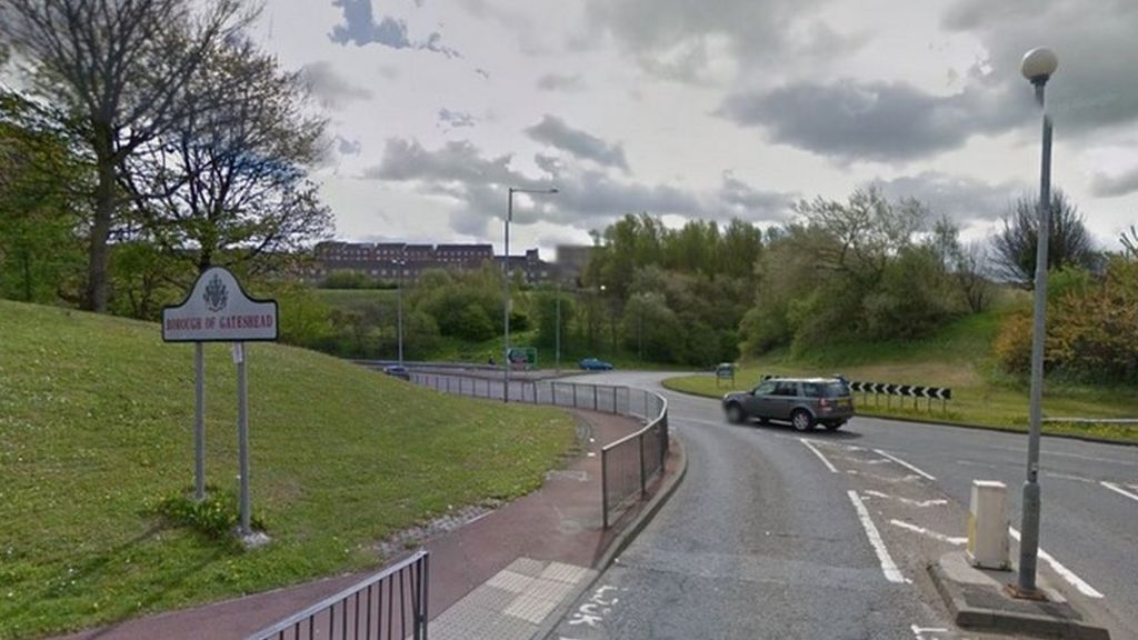 One dead as crash leaves car on roof on Gateshead roundabout - BBC News