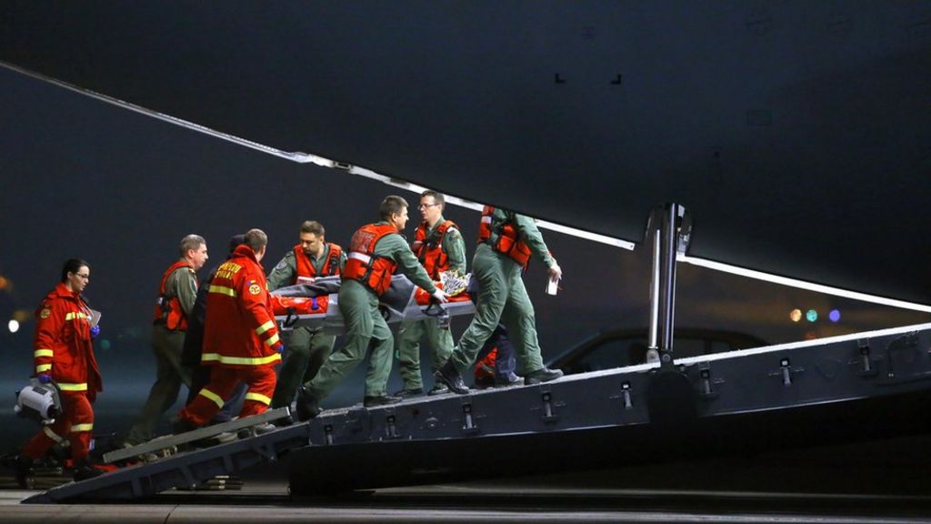 Romania fire victims flown to UK