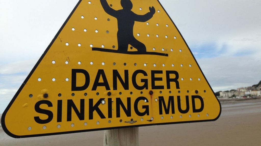 Stuck walker rescued from beach mud