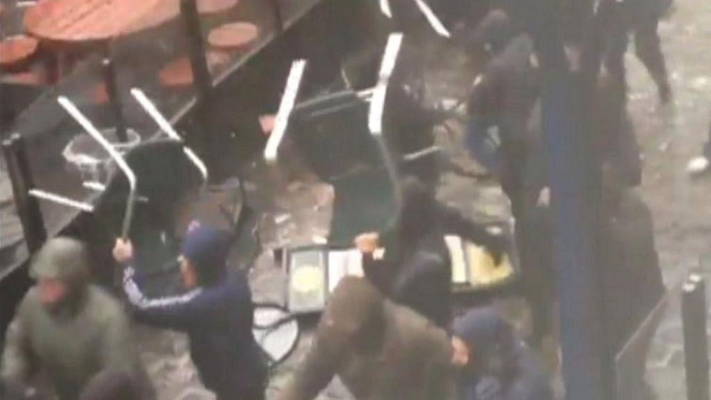 Football fans arrested over chair fight