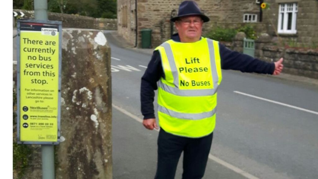 Whittington bus cuts protester in high-vis hitch-hike