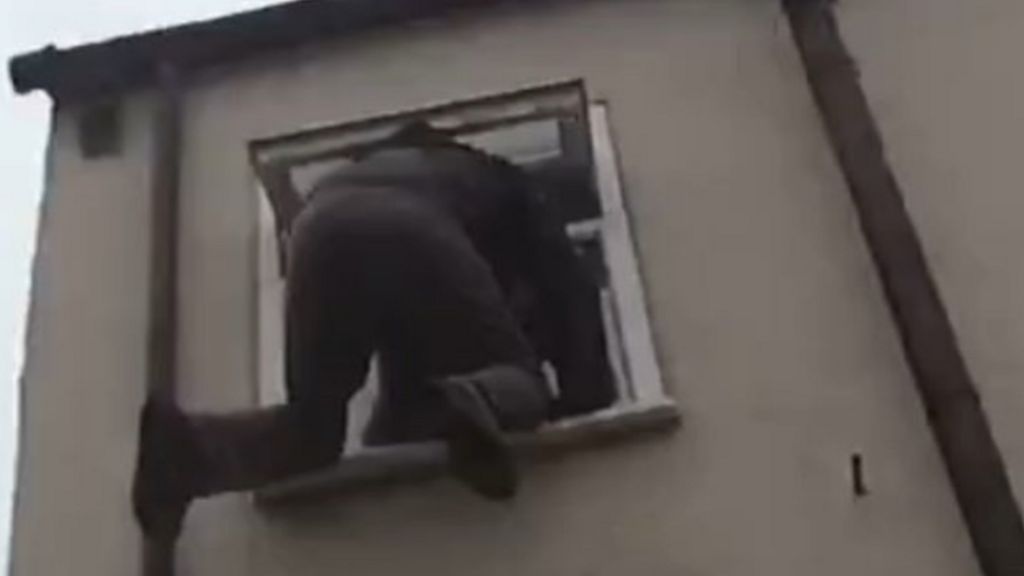 Bungling burglar caught after getting stuck in a bathroom window