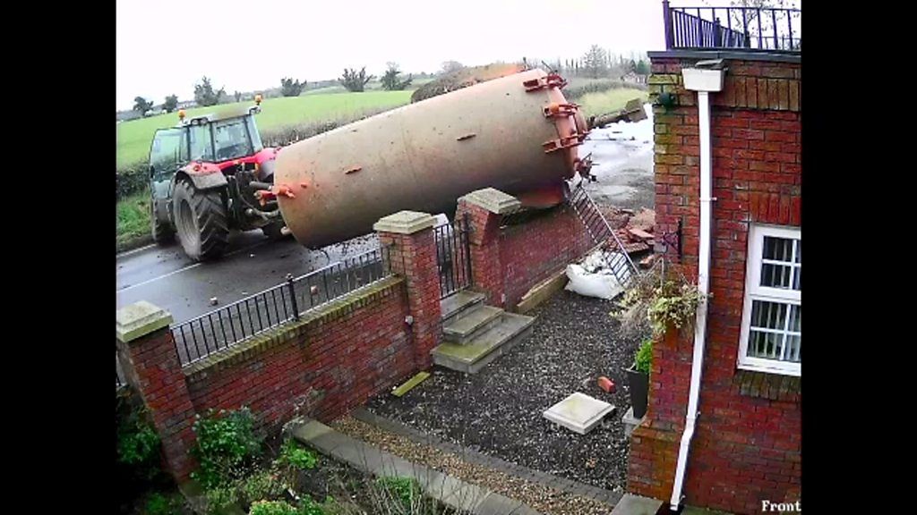CCTV captures moment slurry tank crashes through garden wall