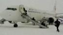 Passengers escape the plane