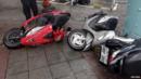 A man inspects motorcycles tipped over by strong wind from Typhoon Soudelor in Taipei