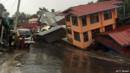 Apartments are destroyed following a landslide due to heavy rain in Harkhar, Chin State of Myanmar on July 30, 2015.