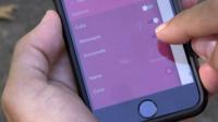 A person holding a phone using the onoff app