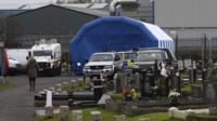 Police at scene of exhumation of Daniel Rooney's body