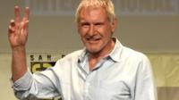 Actor Harrison Ford walks onstage at the Lucasfilm panel during Comic-Con International 2015
