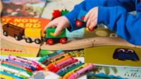 Child playing with train
