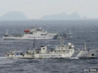 Chinese surveillance ships with the disputed Diaoyu/Senkaku islands in the background on 23 April 2013