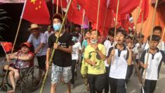 Villagers in Wukan, China march in support of jailed chief