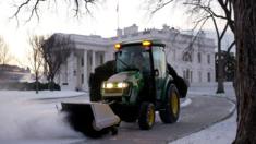Crews clear a road on the White House grounds