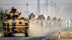 Turkish Army tanks driving to the Syrian Turkish border town of Jarabulus