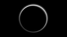 Pluto backlit by the Sun