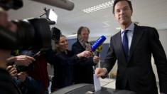 Prime Minister Mark Rutte cast his vote in The Hague, as he was followed by a Russian TV crew (6 April)