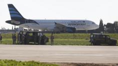 Afriqiyah Airways plane surrounded by troops at Malta Airport (23 December)