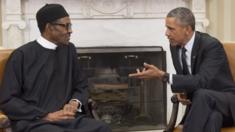 US President Barack Obama speaks with Nigerian President Muhammadu Buhari during a meeting in the Oval Office of the White House in Washington, DC, July 20, 2015.