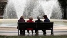 Elderly people sitting on a bench