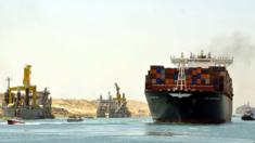 Container ships and pilot boats sail on the waterway of the New Suez Canal in Ismailia, east of Cairo, Egypt, 25 July 2015.