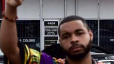 Images from the Facebook page of Micah Johnson showing him giving a 'black power' salute