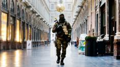 Belgian Army soldier walks through the Galleries Royal Saint-Hubert in the center of Brussels.