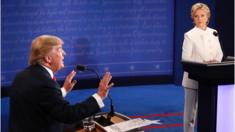 Republican nominee Donald Trump gestures as Democratic nominee Hillary Clinton looks on during the final presidential debate at the Thomas ^ Mack Center on the campus of the University of Las Vegas in Las Vegas, Nevada on October 19, 2016.