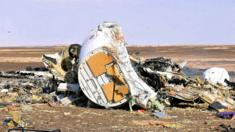 Debris from crashed Russian jet lies strewn across the sand at the site of the crash, Sinai, Egypt, 31 October 2015.