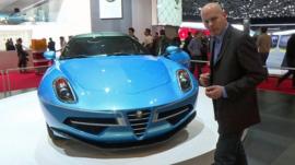 BBC reporter Theo Leggett and an Alfa Romeo at the Geneva Motor Show