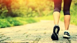Woman walking with trainers