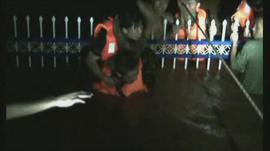 Firefighters pulling passengers to safety