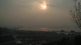 Sun breaks through cloud over Three Gorges Dam, China