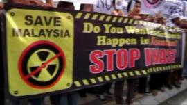 Activists demonstrate against the rare earth refinery